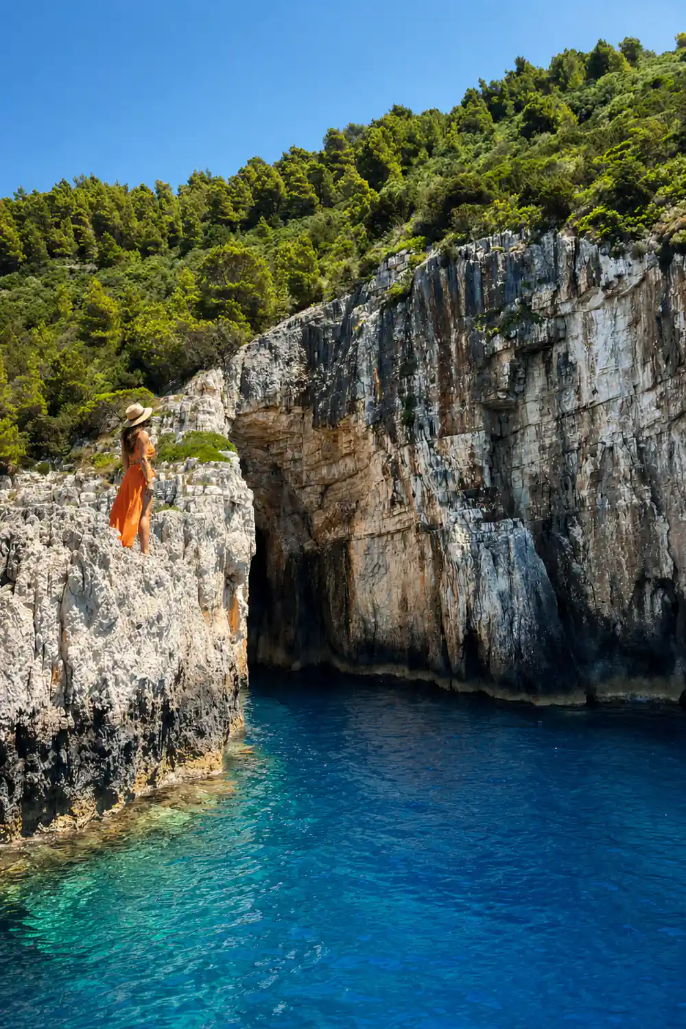 a long stretch of white cliff above deep blue water